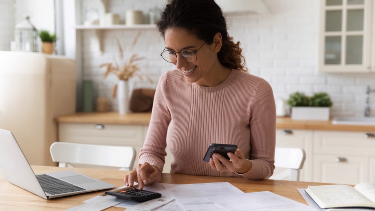 Woman budgeting with mobile