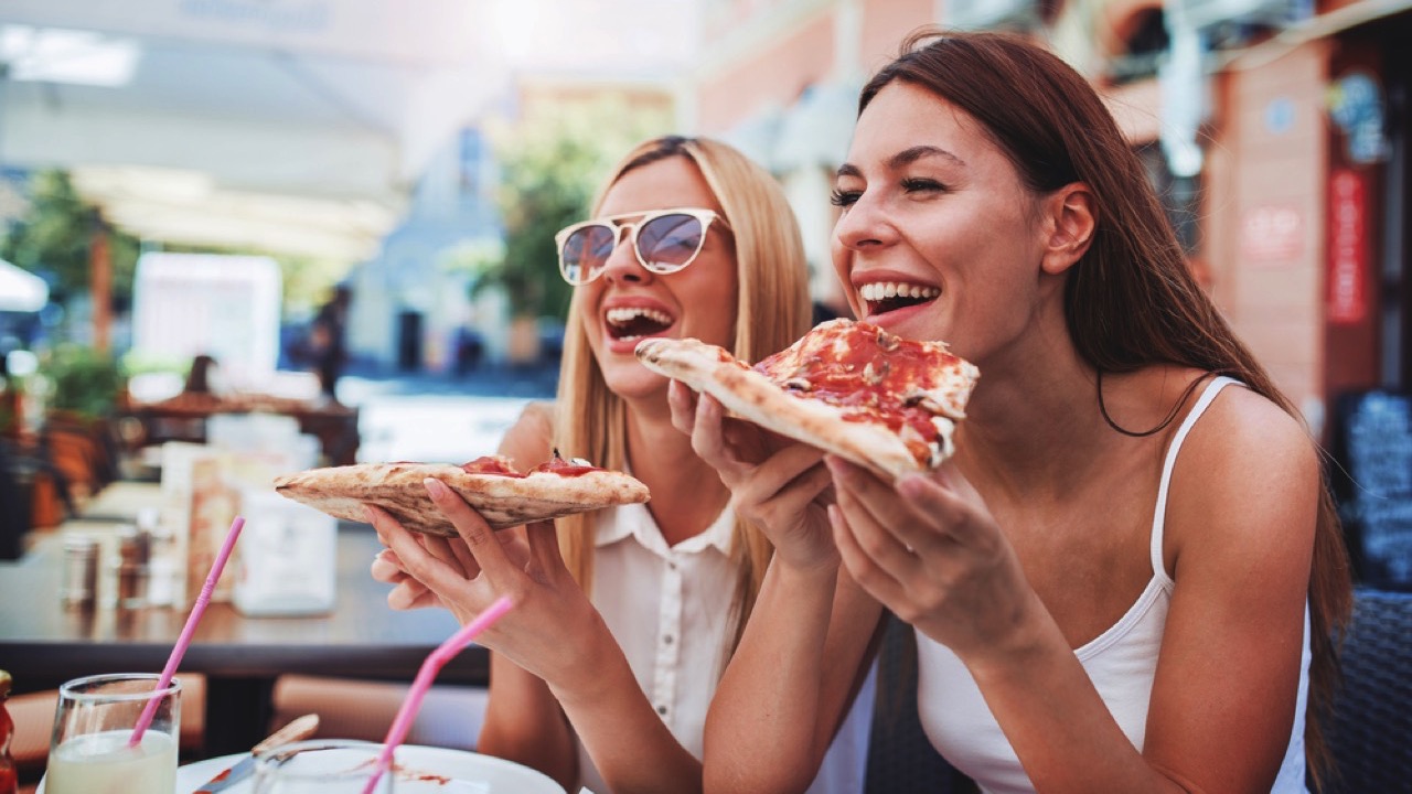 Friends eating Pizza in Europe