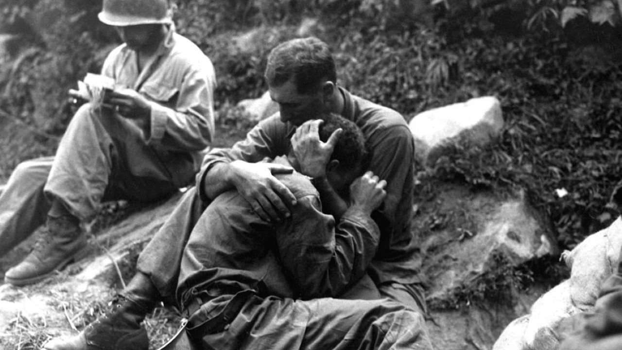 G.I. comforting a grieving infantryman, Korea