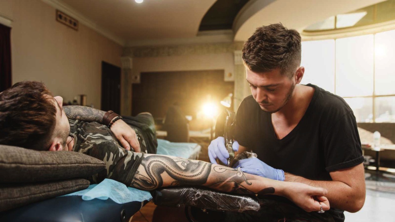 Man getting tatooed